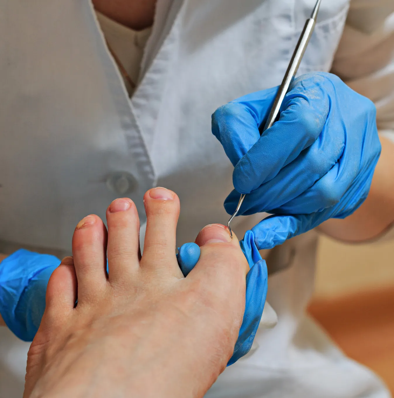 Podiatrist Treating Patient